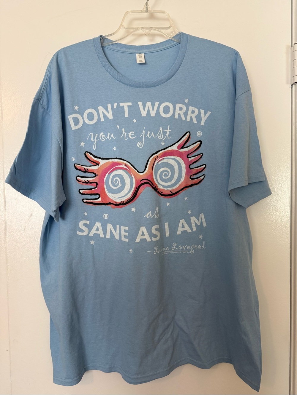 Light Blue Graphic Tee with Pink & White Sunglasses Design